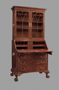 A desk with two bookcases and drawers.