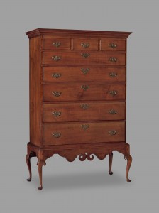 A tall chest of drawers with six large drawers.