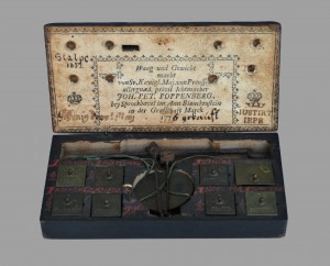 A box with some old fashioned keys in it